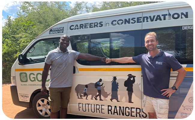 Mbhoni and Matt, celebrating 5 years working together with the arrival of their new Future Rangers bus.