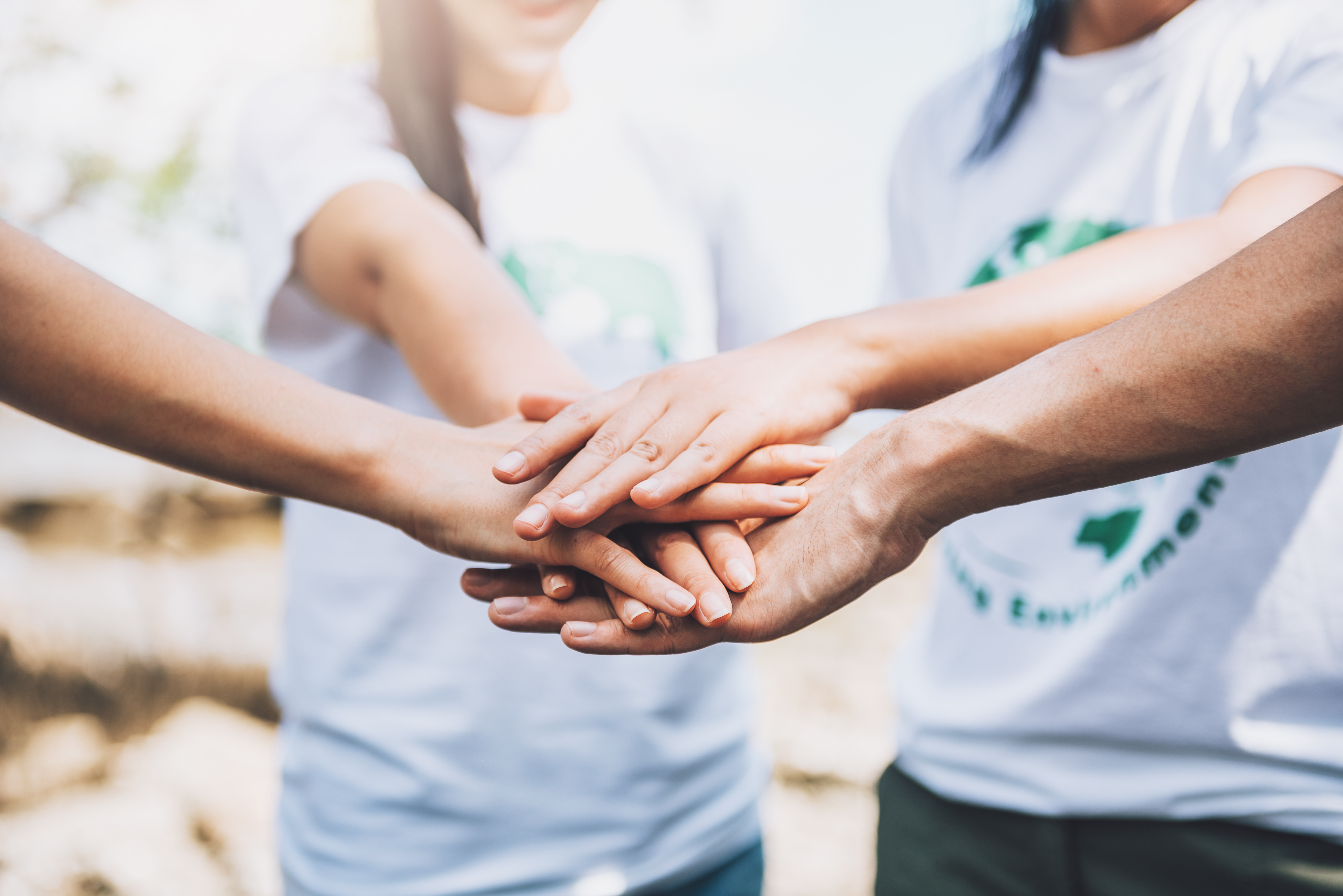 lose-up-people-volunteer-teamwork-putting-finger-star-shapehands-togetherstack-handsunity-teamwork-world-environment-day