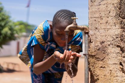 African Girl Drinking Water in Bamako Mali - iStock/Riccardo Lennart Niels Mayer